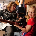 Kris Hadlock and girl play guitars